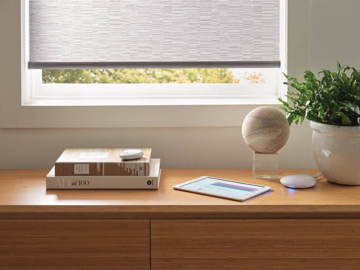 Convenient app and smart home control with Hunter Douglas PowerView® Automation devices on a table