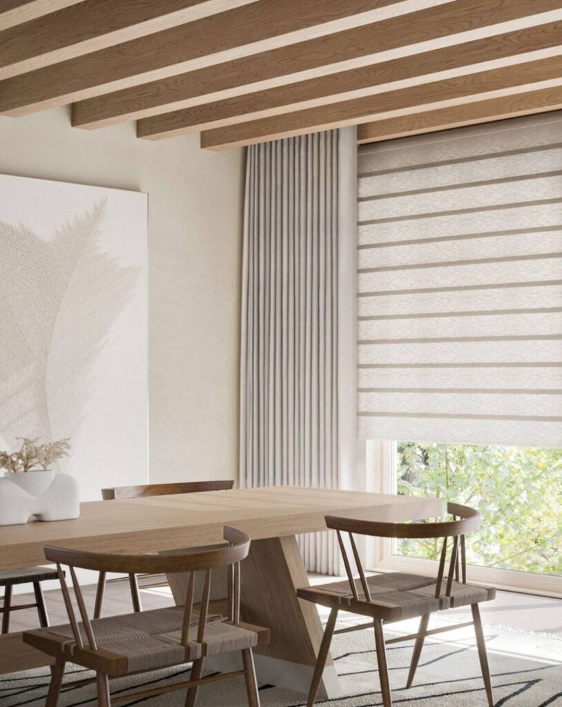 A dining room featuring shades layered with drapery near Colorado Springs, CO
