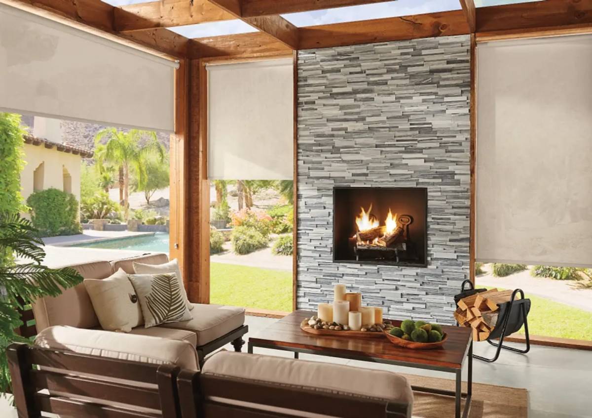 Graber Exterior Solar Shades surrounding an outdoor living area and fireplace.