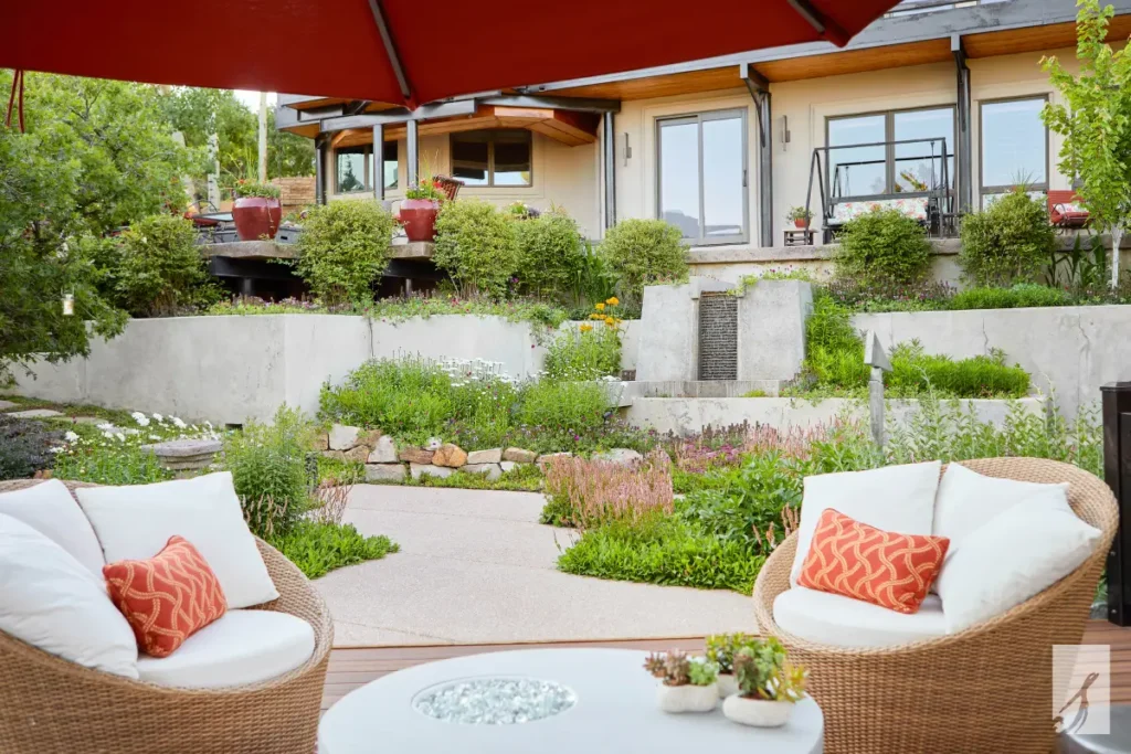 A summer patio full of real annuals and perennials in peak bloom