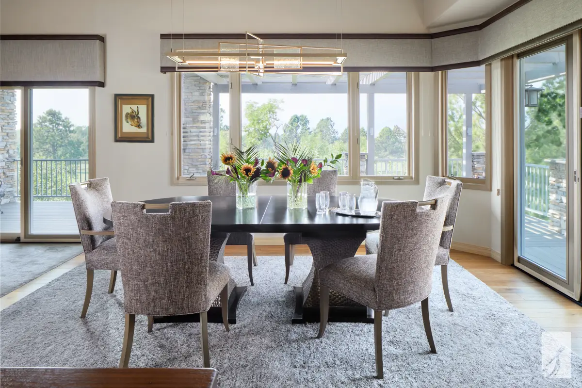 An upholstered cornice unifying a run of windows above a dining room window